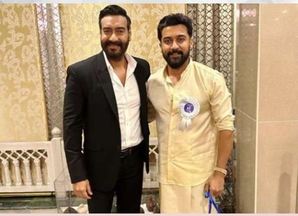 Ajay Devgn poses with Suriya for a photo at the 68th National Film Awards and expresses his admiration for his talent.