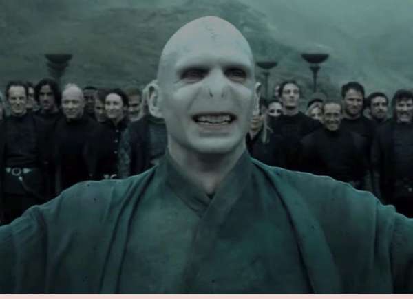 Tom Felton claims that Ralph Fiennes, who played Voldemort and Draco in the most recent film, fabricated their awkward hug.