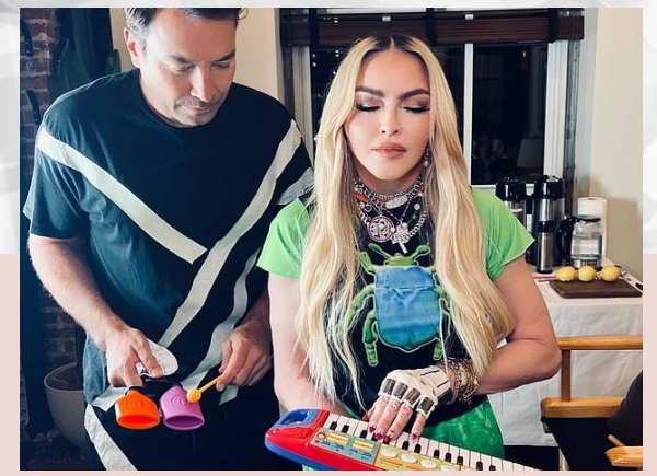While Jimmy Fallon joins in on the joke, Madonna, 63, plays with a toy keyboard.